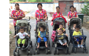 nannies with children in strollers